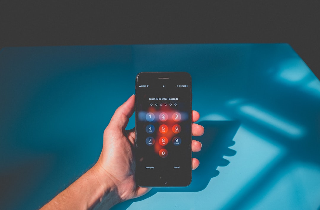Person holding iPhone displaying calling interface for mobile VoIP softphone app