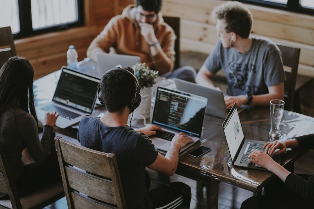 Software development team collaborating on custom VoIP softswitch development project