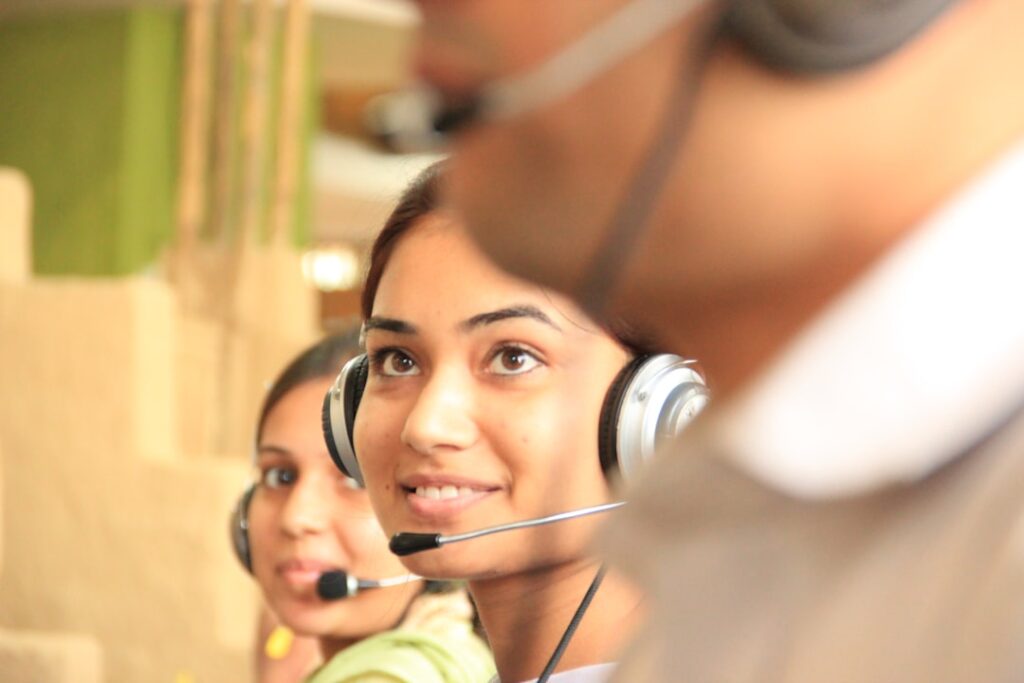 Call center representative using headset demonstrating cloud PBX features