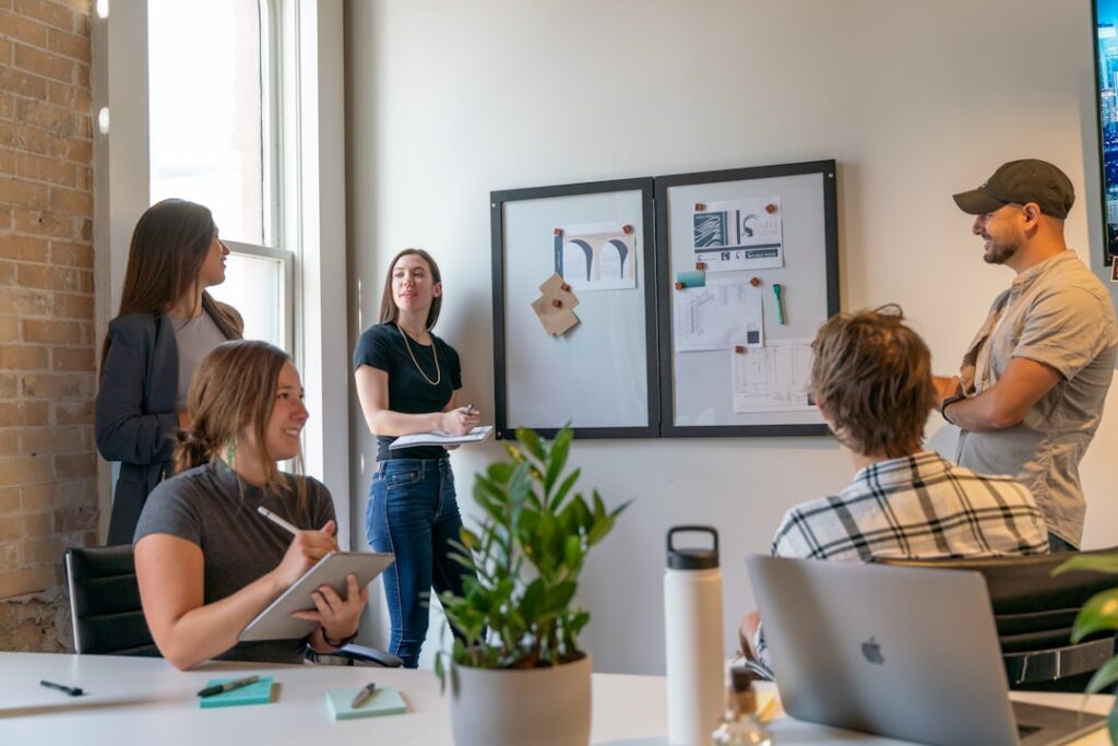 Hybrid team meeting showing collaboration between in-person and remote participants using modern communication technology